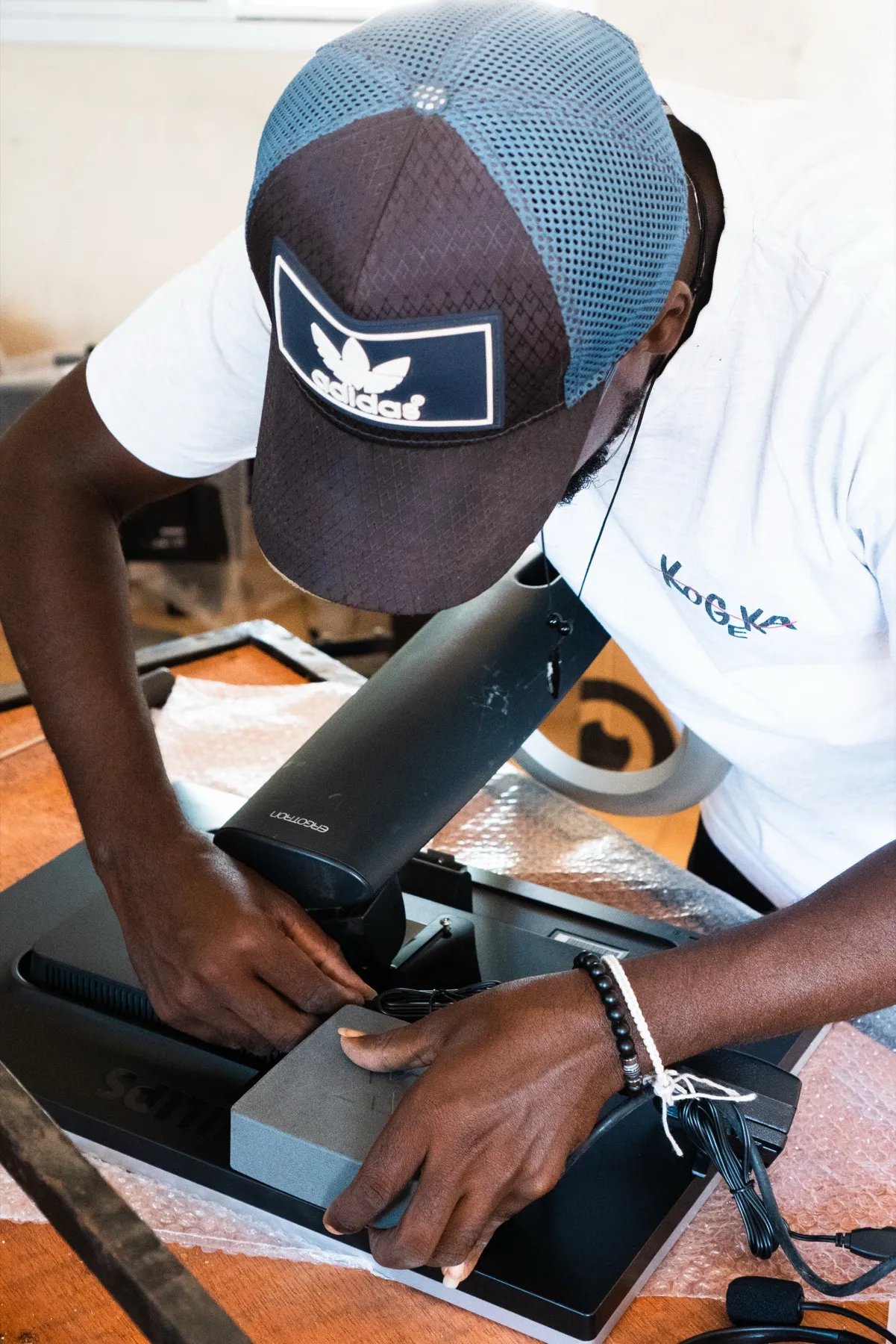 A local technician setting up a KUBO X workstation